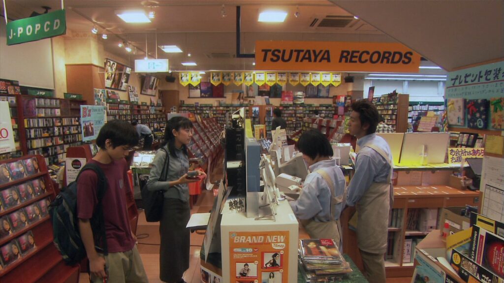 A scene inside Tsutaya Records in All About Lily Chou-Chou (2001) captures early 2000s Japanese youth culture.