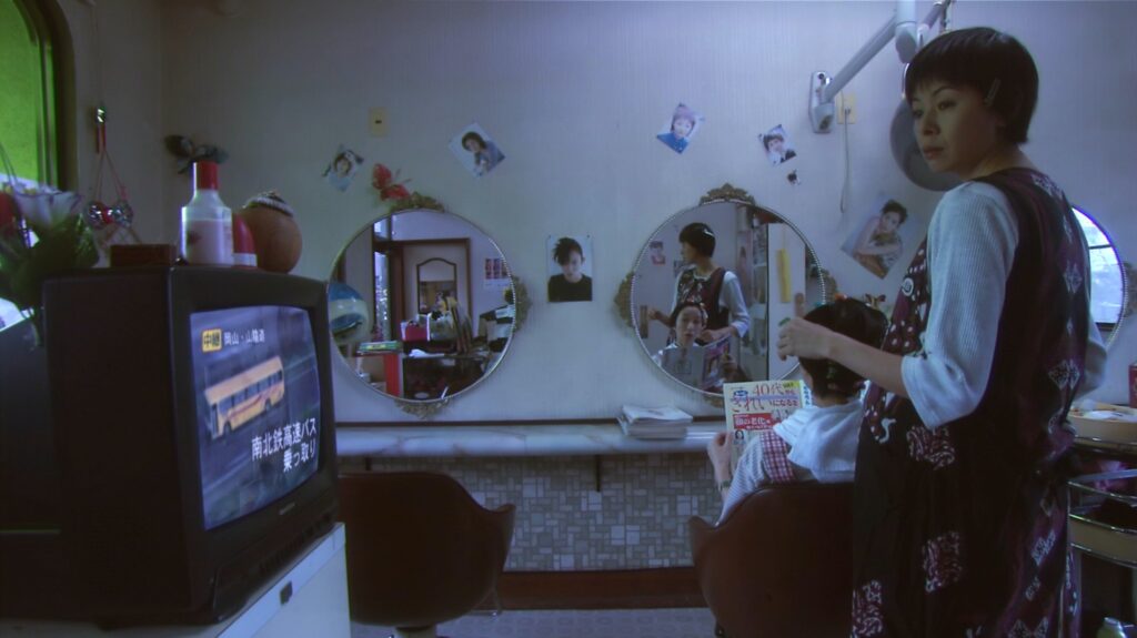 An intimate interior scene from All About Lily Chou-Chou (2001) showcases Shunji Iwai's visual storytelling.