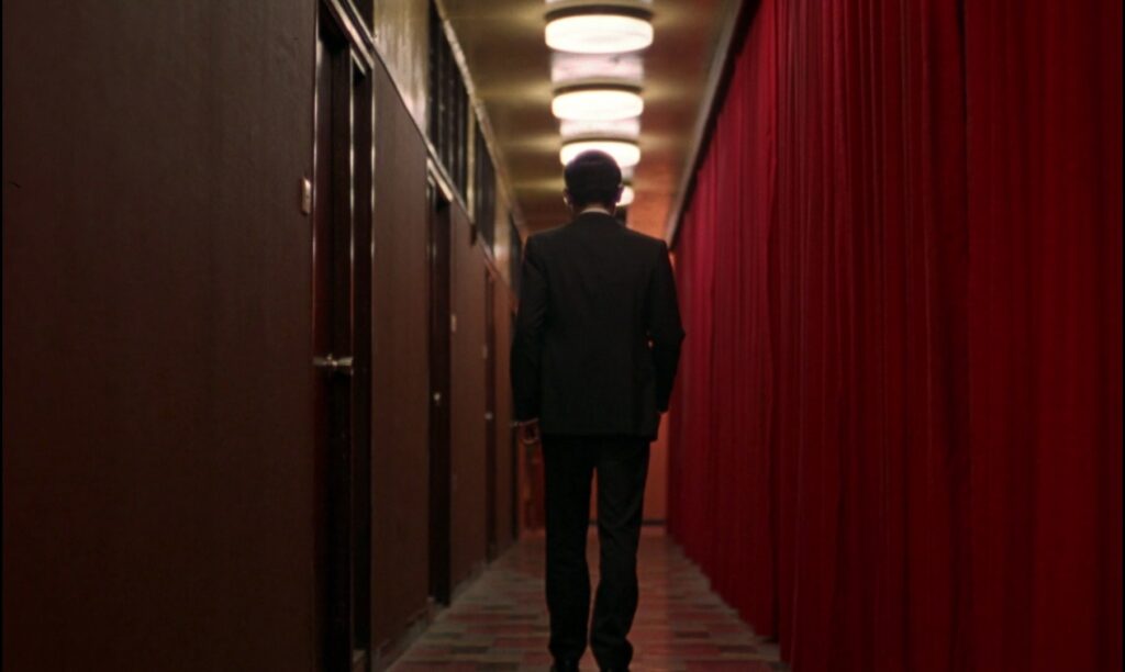 The striking hallway in In the Mood for Love (2000) reflects Wong Kar-wai's signature visual storytelling.