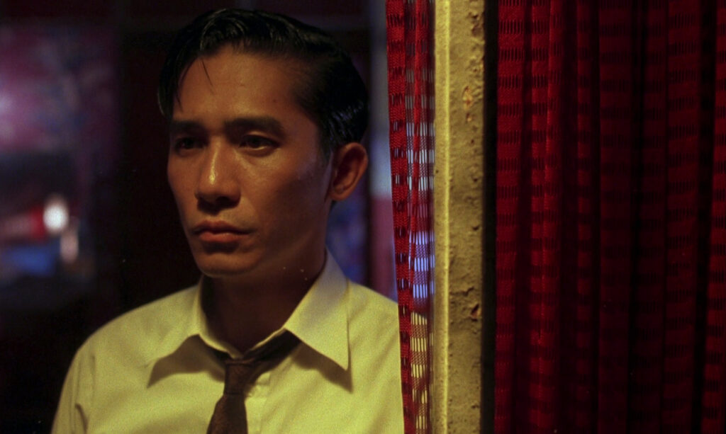 A contemplative portrait of Tony Leung in In the Mood for Love (2000), emphasizing solitude and restrained emotion.