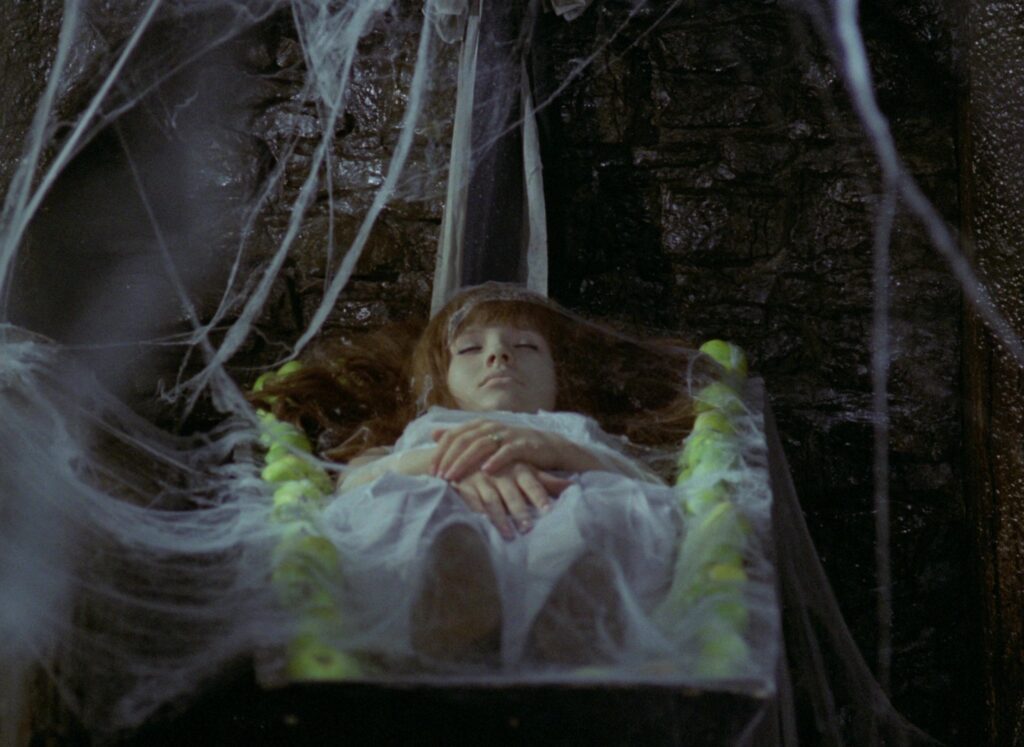 Valerie rests in a suspended bed beneath a large tree in Valerie and Her Week of Wonders (1970).