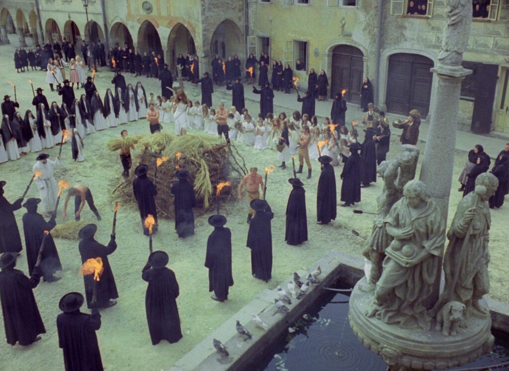 A ritual gathering takes place in a village square in Valerie and Her Week of Wonders (1970).