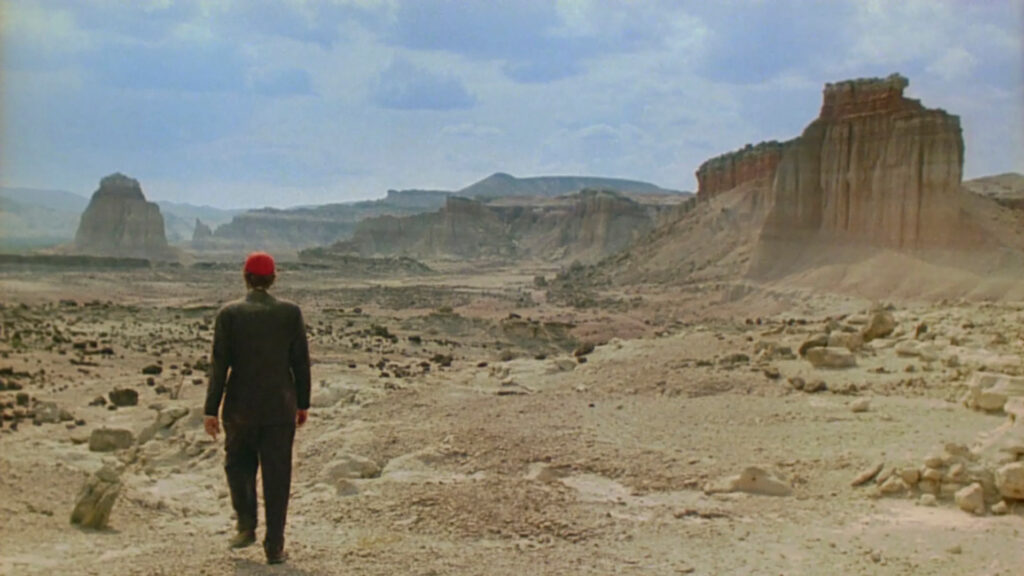 The expansive desert scenery in Paris, Texas (1984) reflects Wim Wenders' iconic visual storytelling.