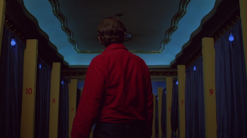 A striking interior scene in Paris, Texas (1984) highlights Wim Wenders' use of color and visual storytelling.