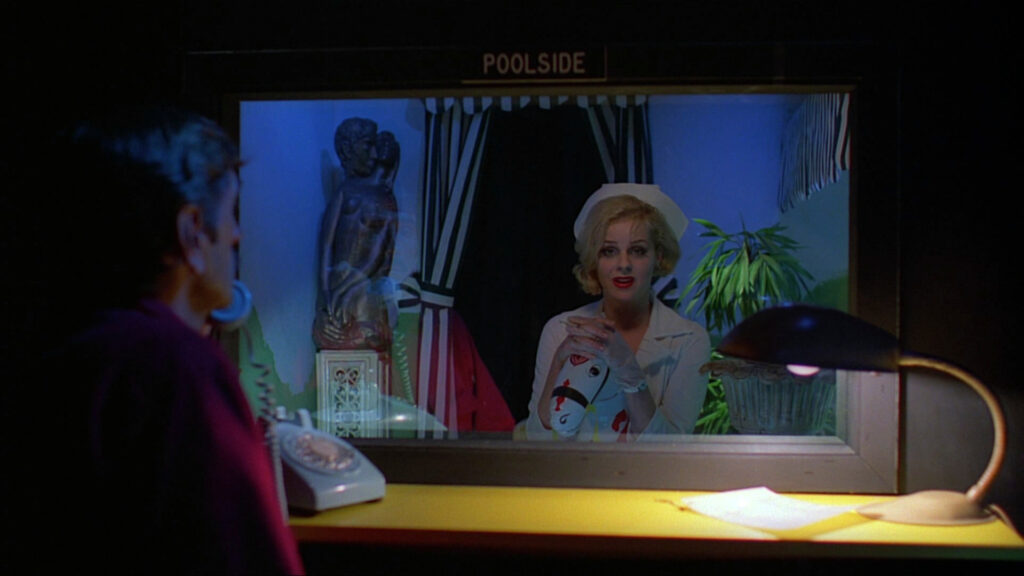 Jane speaks through a window in Paris, Texas (1984), during one of the film's most emotional scenes.