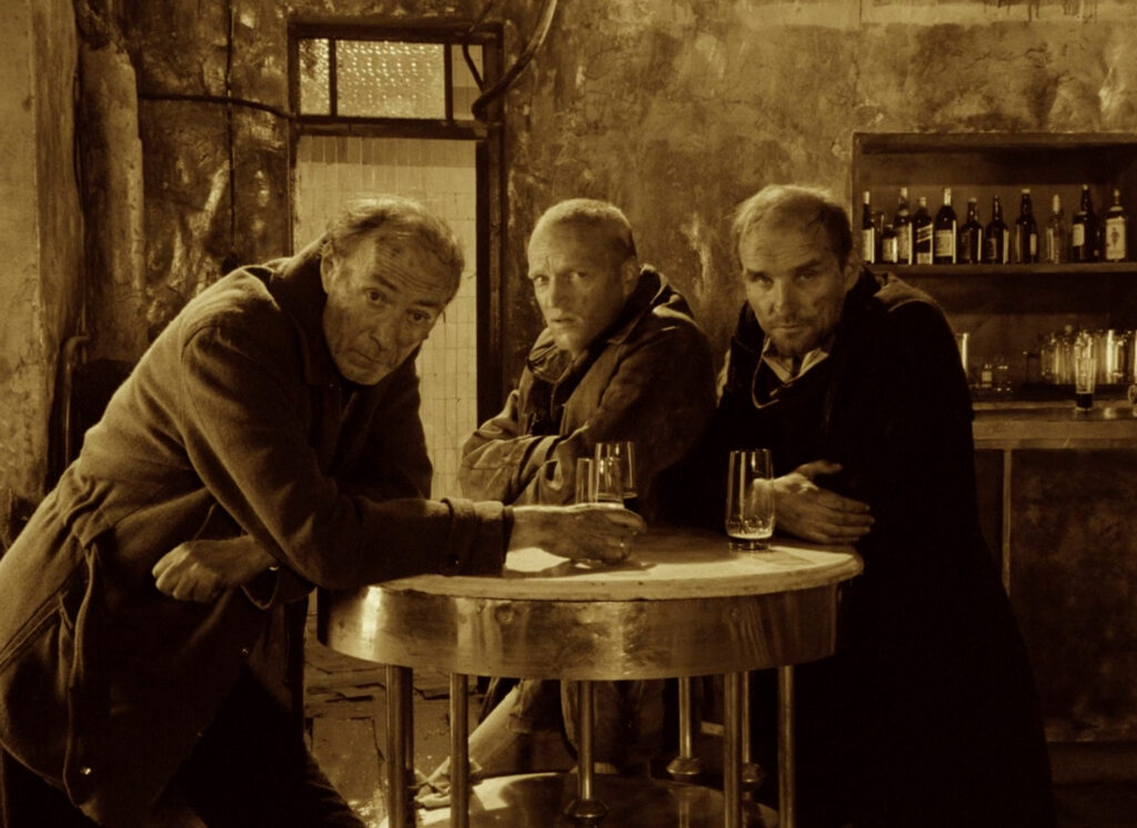Stalker (1979) sepia bar scene with the Stalker, Writer, and Professor before entering the Zone