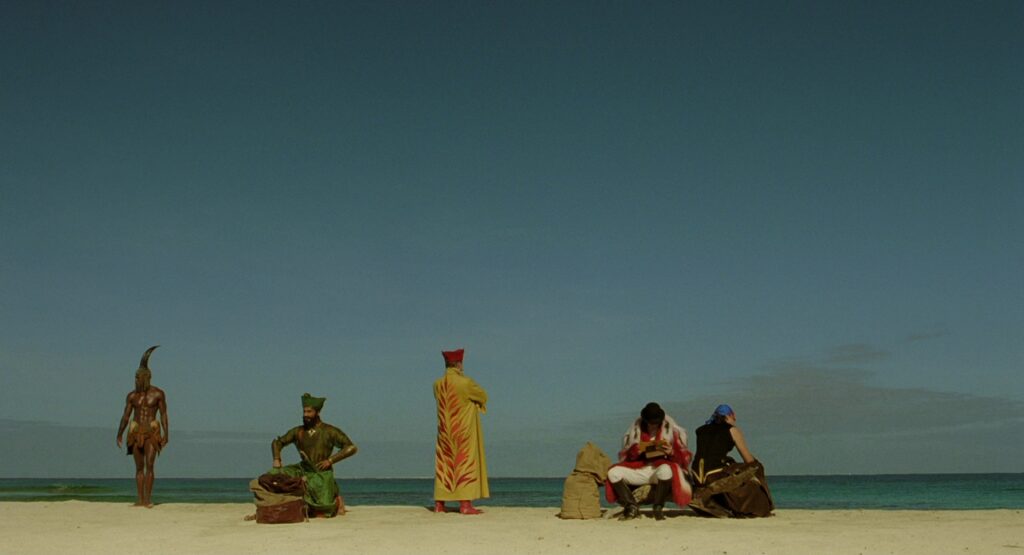 The Fall (2006) still — Roy's fantasy heroes gathered on a beach in Tarsem Singh's visually stunning epic