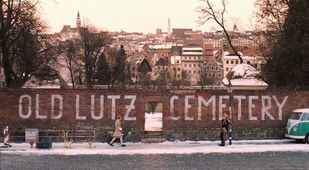 The Grand Budapest Hotel (2014) Old Lutz Cemetery street scene in Zubrowka