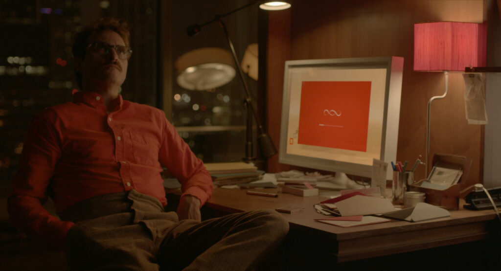 Theodore watching the OS1 artificial intelligence installation screen in Her (2013)
