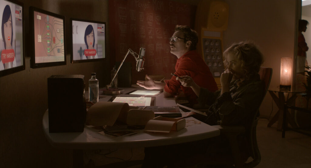 Theodore and Amy reviewing animated screens together in Her (2013)