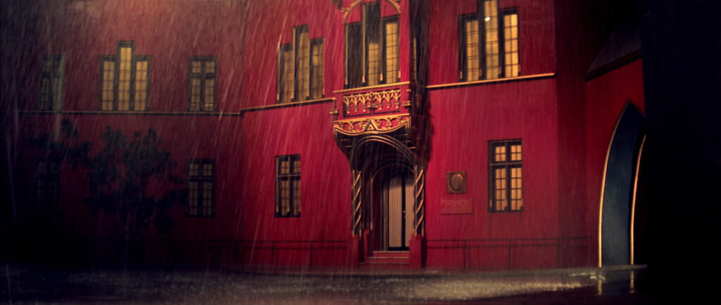 The rain-soaked entrance of the dance academy in Suspiria (1977).